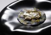Raviolo aperto al nero di seppia con ragù di polpo © COB